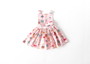 Girls pinafore dress in cakes print by Worthy Threads, a unique toddler clothing brand.