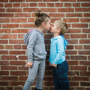 Unique Kids Clothes.  Girl and boy kissing wearing loungewear sets.  Matching sibling outfits!