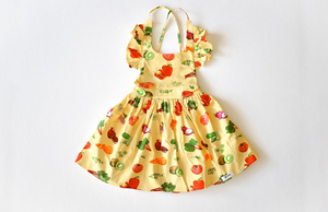 Girls ruffle dress in Farmer’s Market print: fruit and vegetable print by Worthy Threads clothing brand