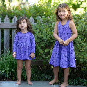 Sister matching outfits in purple robots print