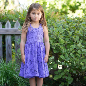 Toddler in purple robots twirly dress 