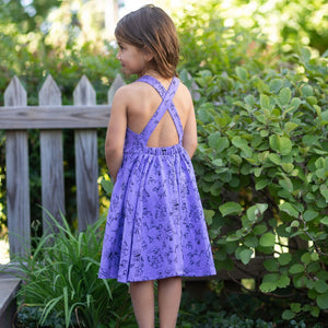 Girls summer twirly dress with cross back in purple robots print