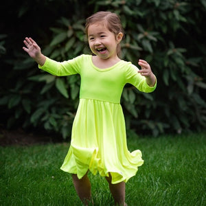 Toddler in neon yellow twirly dress