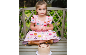 Birthday girl modeling pink cakes ruffle dress