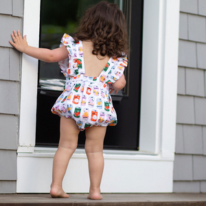 Baby bubble romper with ruffle sleeves, back view of model