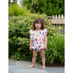 Toddler in baby bubble romper with retro soda can print