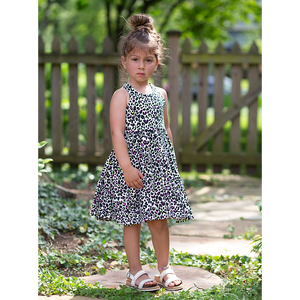 Toddler modeling girls cross back twirly dress in neon leopard print