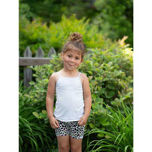 Toddler modeling girls biker shorts in neon leopard print