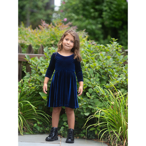 Toddler modeling navy stretch velvet twirly dress