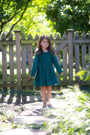 Girl modeling green velvet holiday dress
