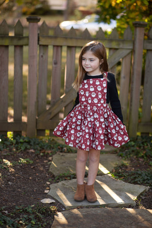 Girls pinafore dress in Christmas Santa’s 