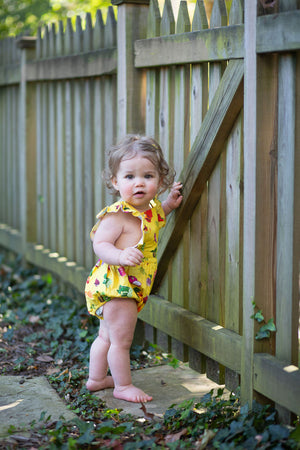 Baby bubble romper in yellow veggie print