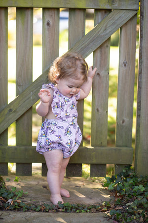 Baby bubble romper in purple roller skates print