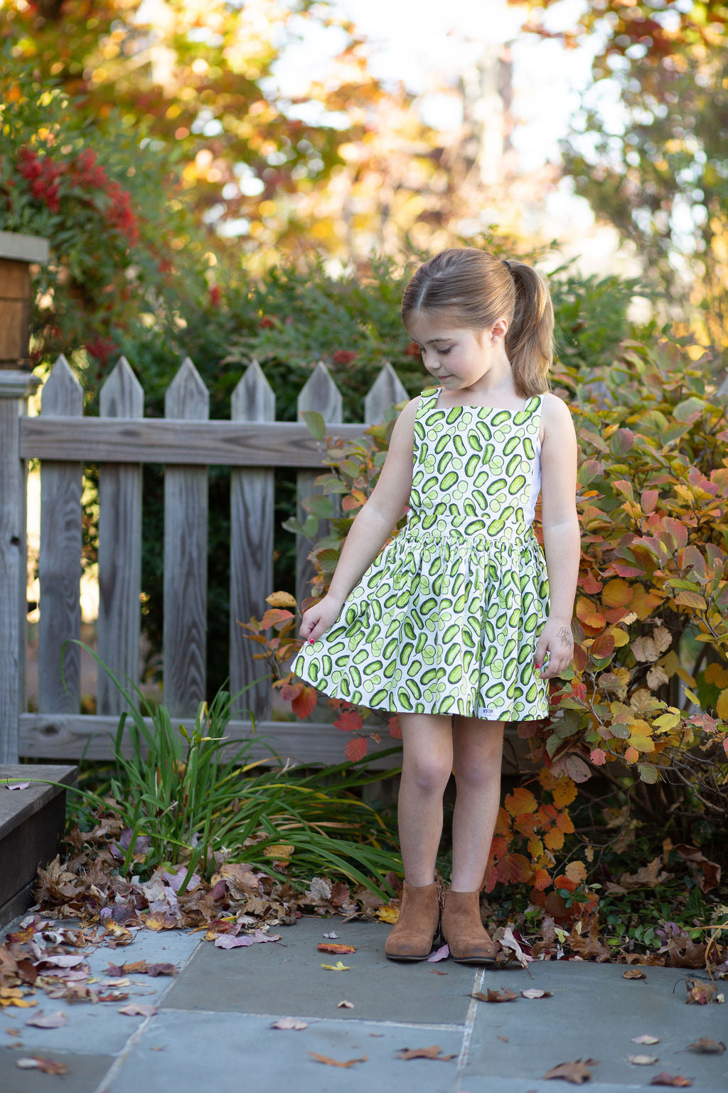 Girls summer dress pinafore style in funky green pickles print