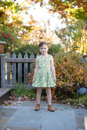 Girls green pinafore dress with pickles print