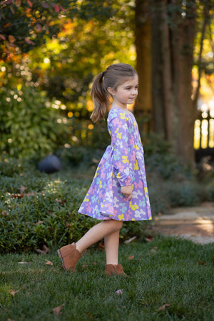 Toddler in purple birthday dress