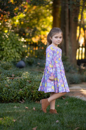 Girl in purple long sleeve birthday dress