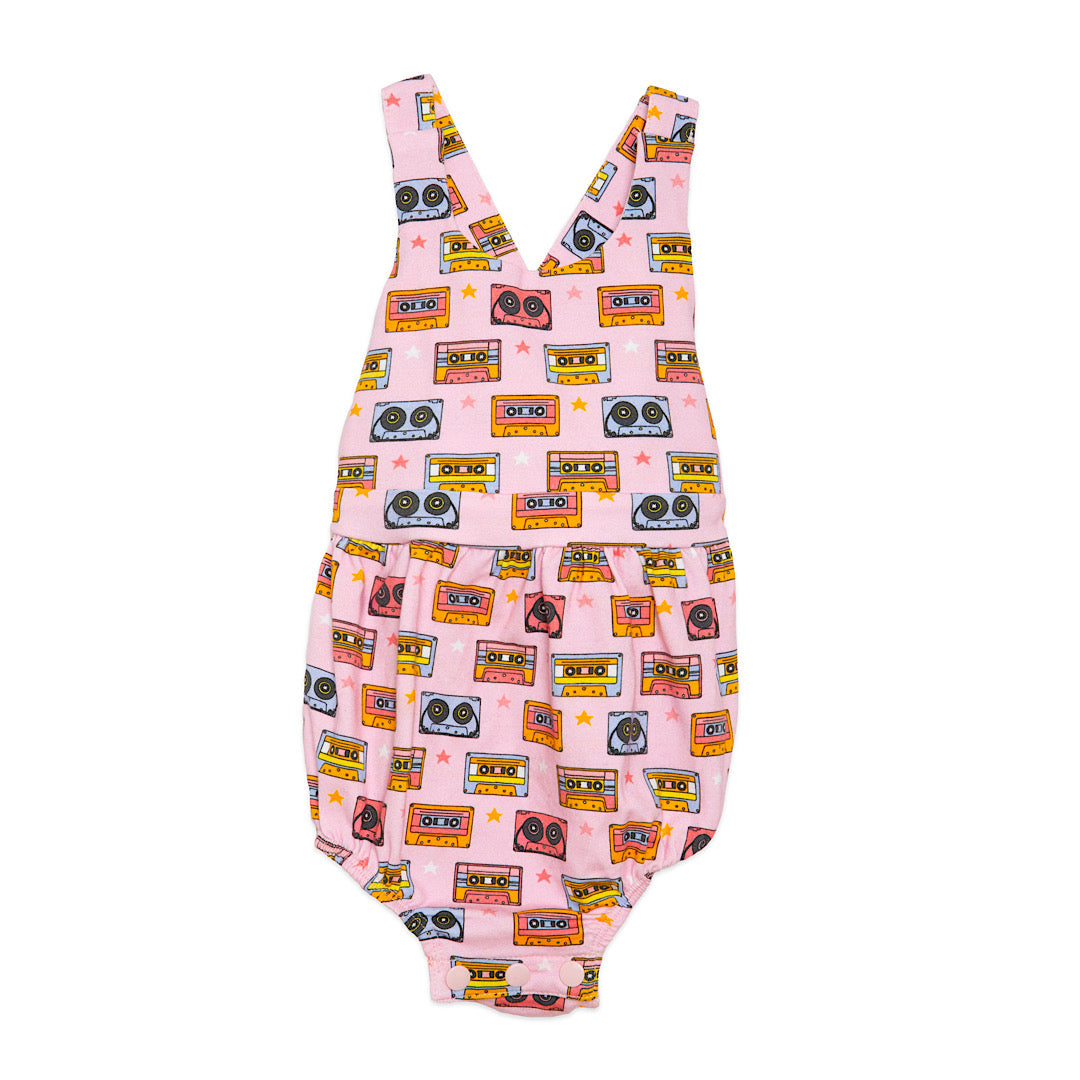 Baby bubble romper in pink retro print, cross back straps