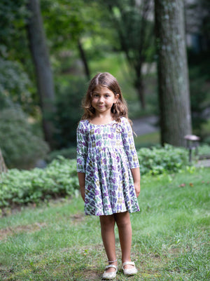 Toddler wearing girls twirly dress in retro funky sneakers print