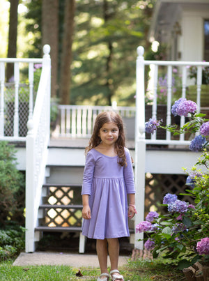 Girl modeling purple twirly dress