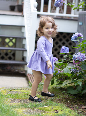 Toddler wearing purple long sleeve bubble romper baby dress in purple