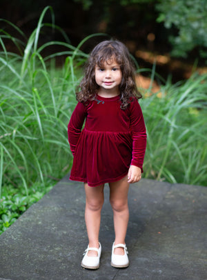 Christmas holiday velvet bubble romper with embroidery modeled by toddler
