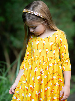 Toddler in girls twirly dress with Christmas Santa print