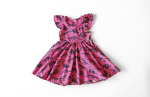 Girls twirly dress with racer back and ruffle sleeves in hot pink dinosaur print