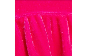 Close up of hot pink stretch velvet on baby bubble romper