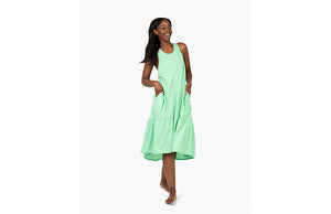 Model in green tank dress with pockets