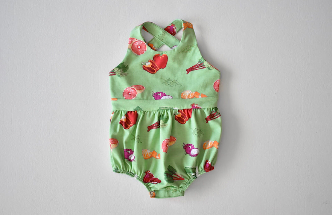 Baby bubble romper in veggie print: cross back design