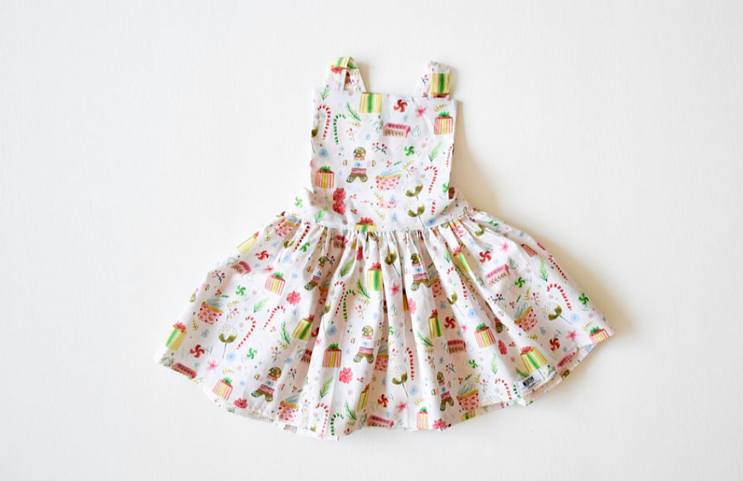 Christmas girls pinafore dress in gingerbread print 