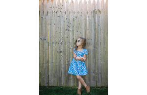 Girl modeling blue ducks ruffle sleeve dress